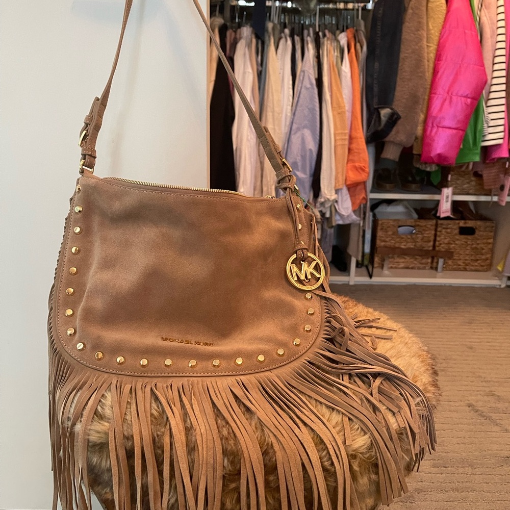 Very boho with fringe genuine suede bag.